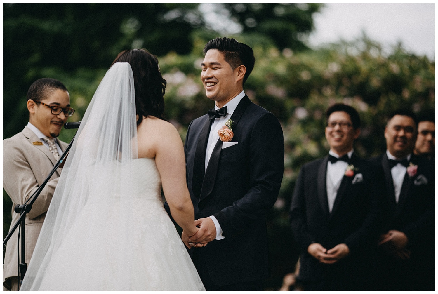 bride and groom laughing during wedding ceremony
