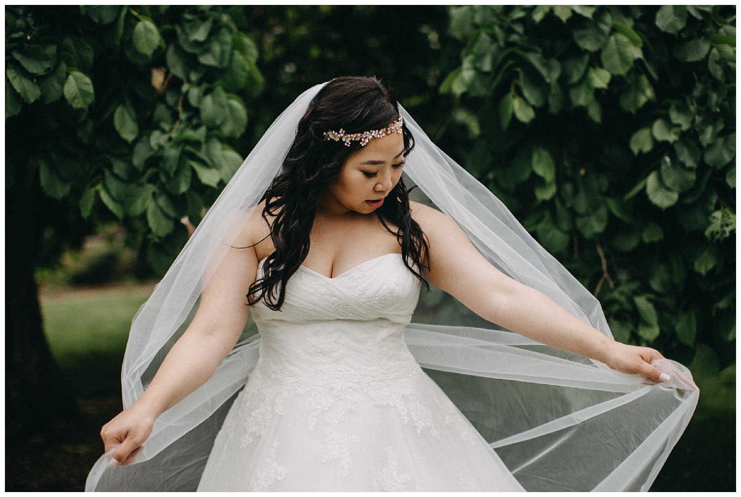 a bride twirls her romantic veil