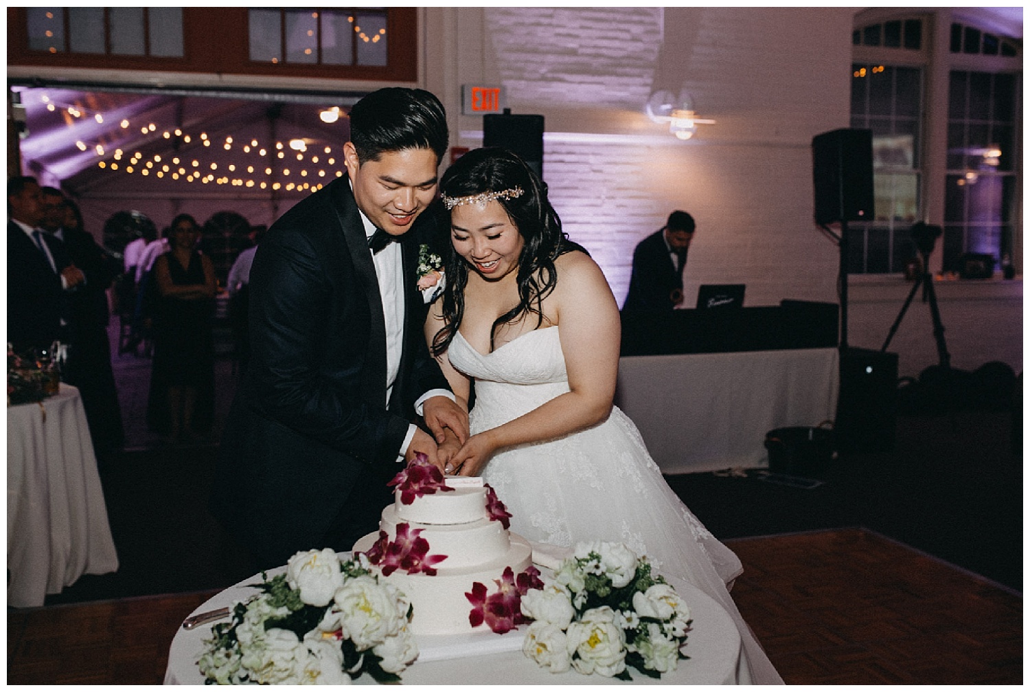 bride and groom cut cake at massachusetts wedding