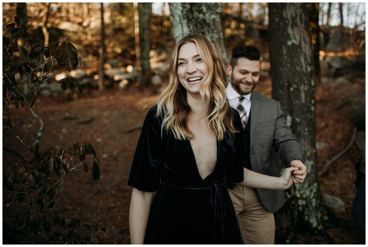 a couple walking in the forest in the catskills