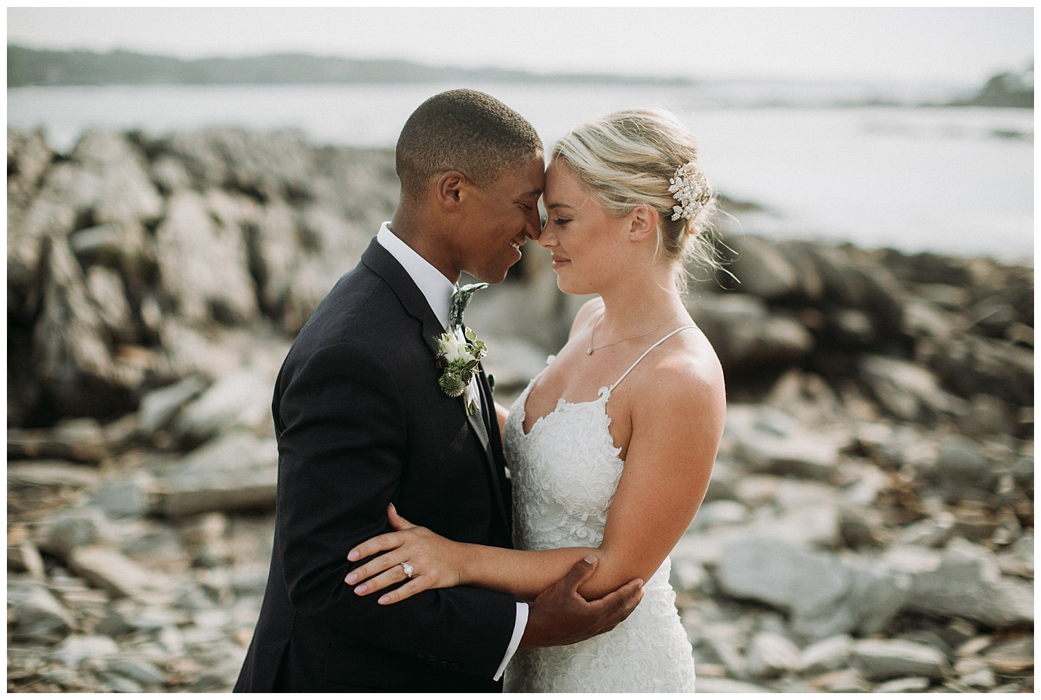 a bride and groom on a beach in Maine