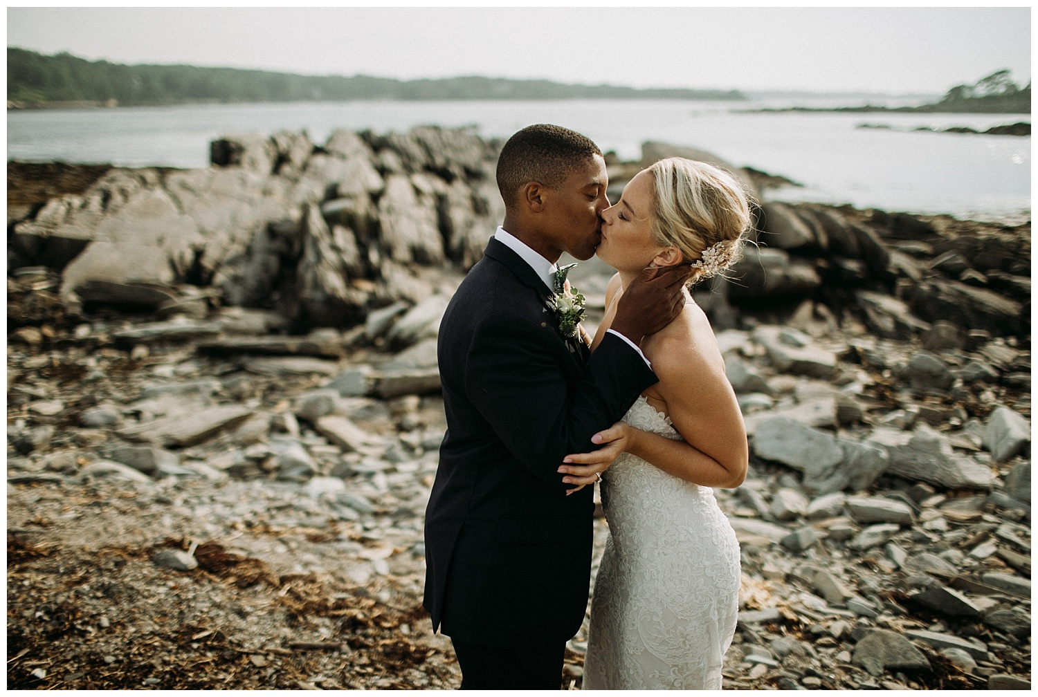 a bride and groom kiss at their Maine wedding