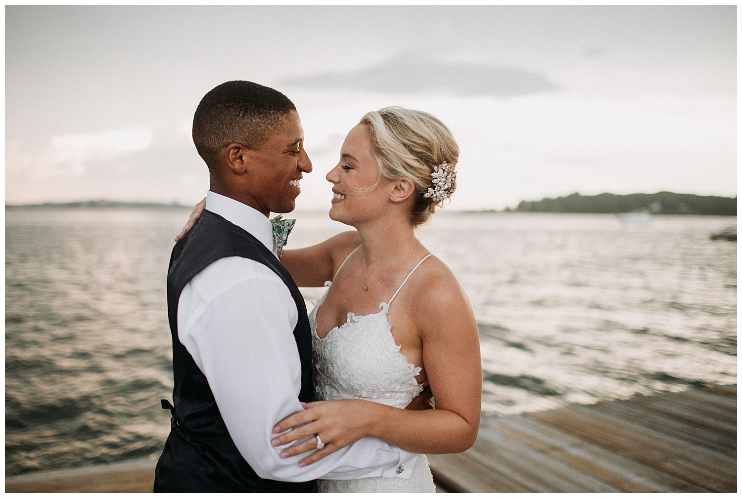 a bride and groom smile at their Peaks Island wedding