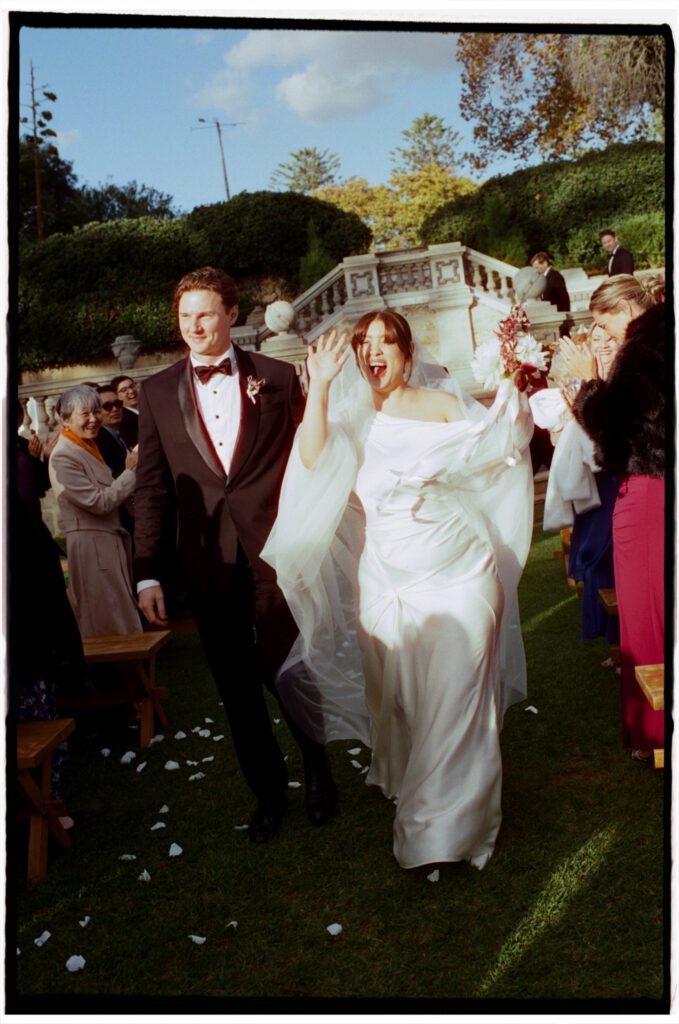 a couple walking after their wedding ceremony at Cottesloe Civic Centre