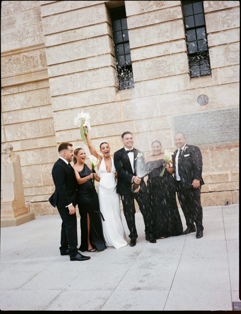 a wedding party poses for portraits at University of Western Australia