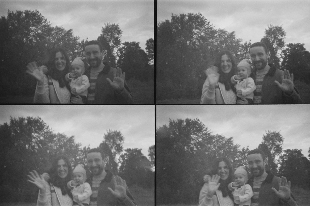 a family waves at the camera during their family portrait session