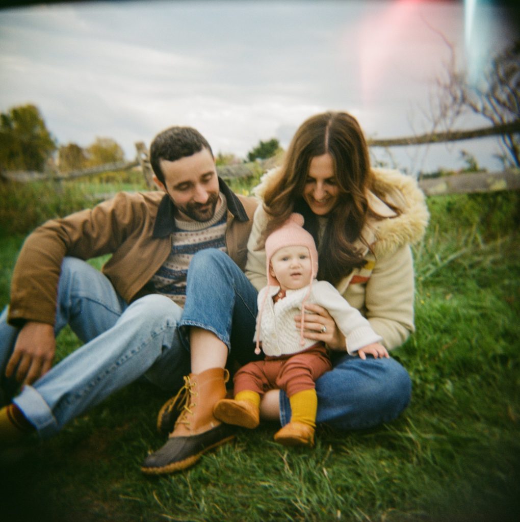a portrait of a family in a field taken on a holga