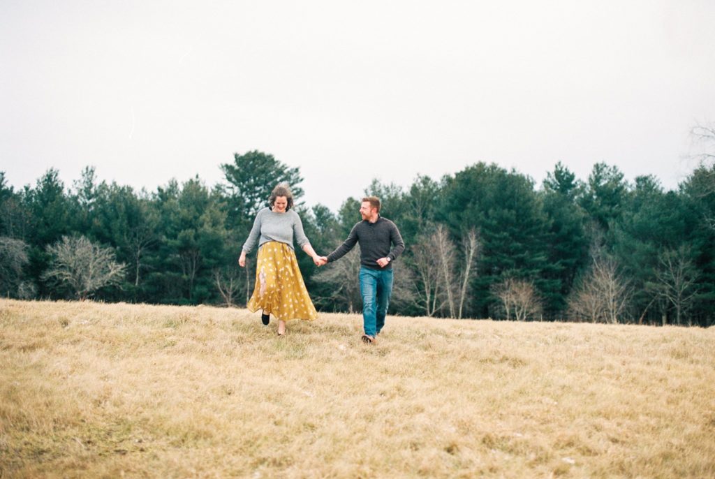 Massachusetts couple frolics through a field