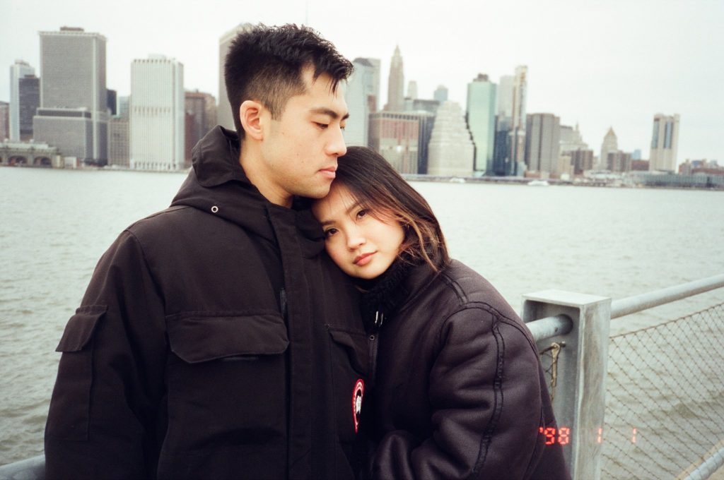Couple in front of NYC skyline on film