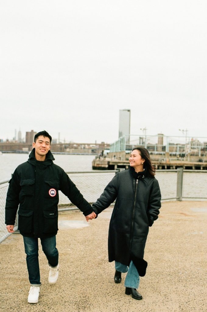 Brooklyn waterfront featuring an engaged couple