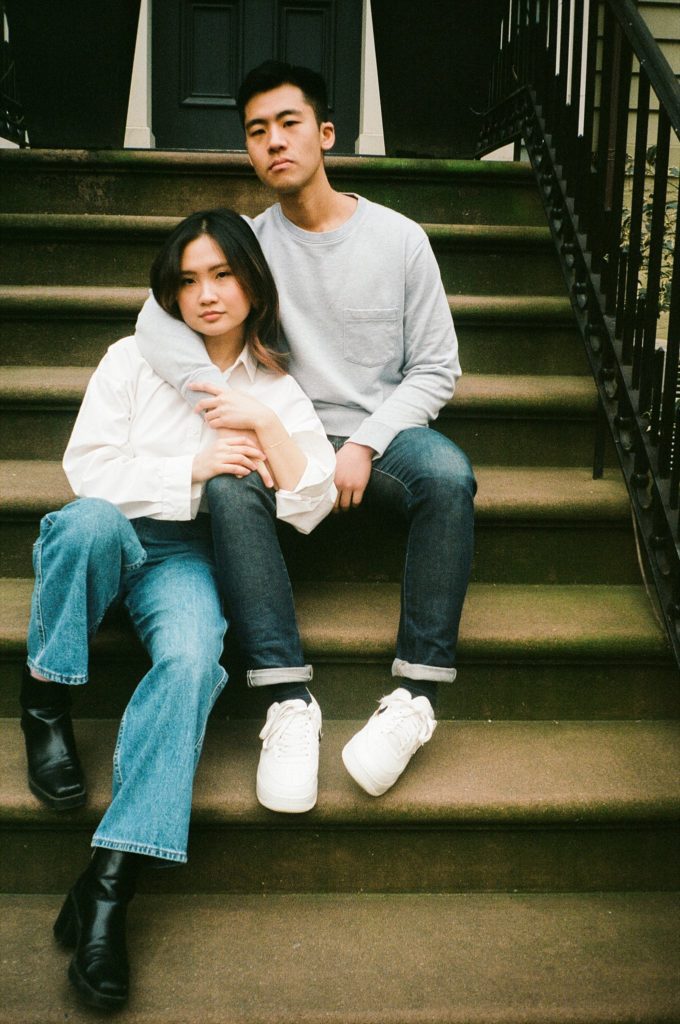 Brooklyn couple sit on a stoop
