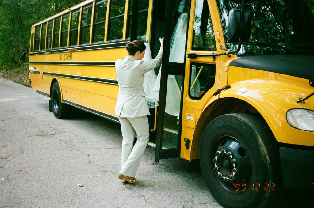 Bride boards school bus to take her to backyard wedding celebration