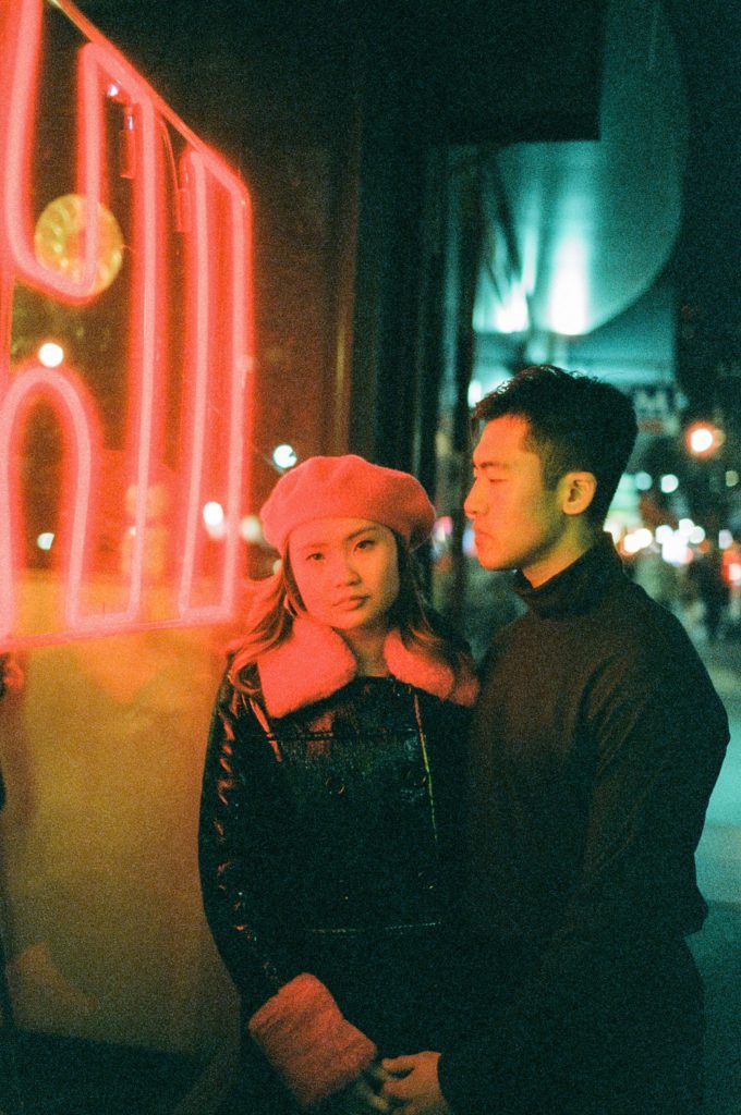 Neon lit film portrait of couple to be wed