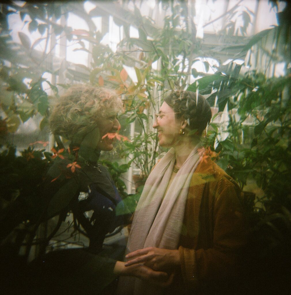 Double exposure film photograph of an engaged couple among botanicals at a Berkshires greenhouse