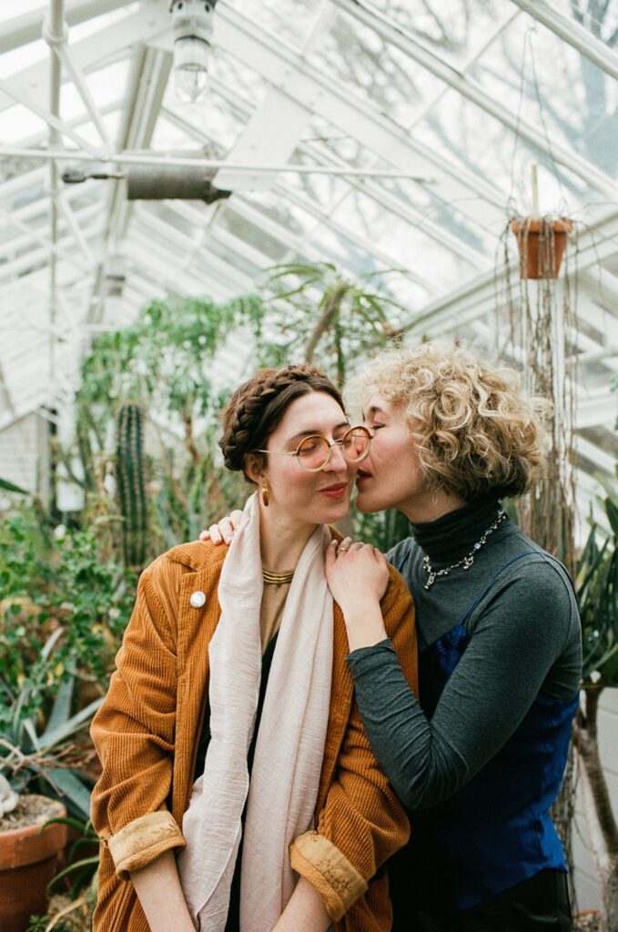 Woman kisses her fiancée in Massachusetts greenhouse