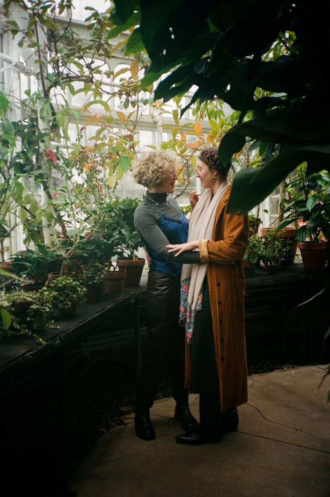 Berkshires greenhouse plants surround same sex couple, captured on film