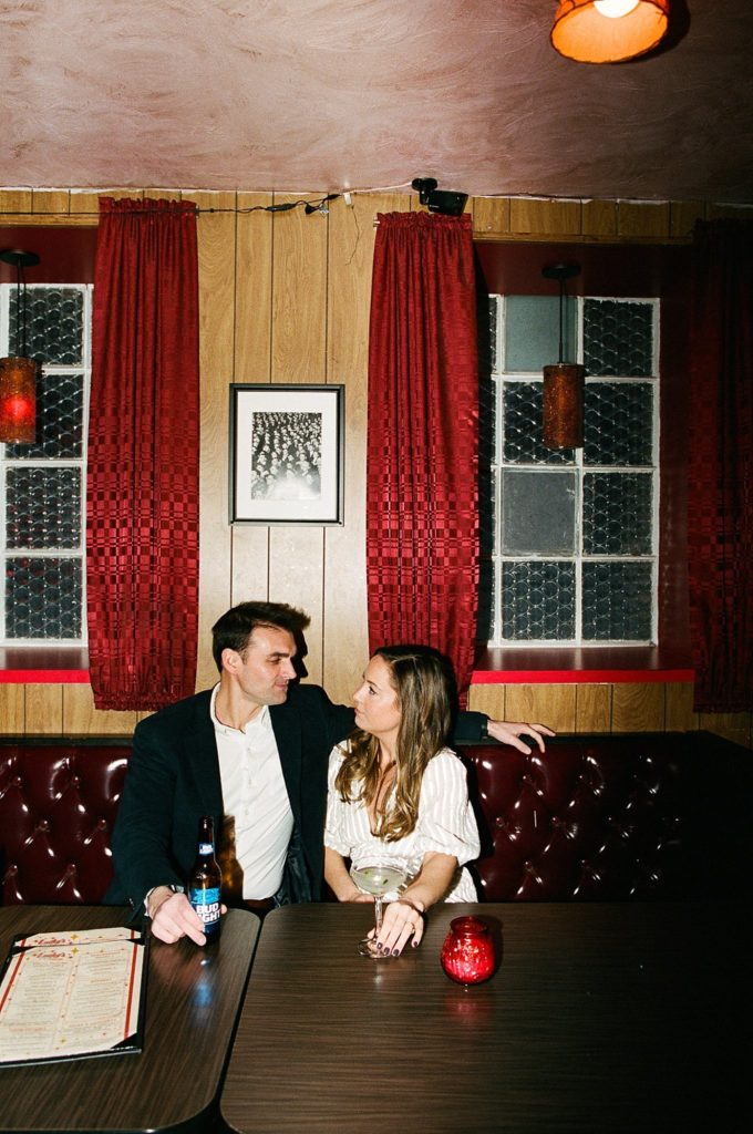 Boston engagement film photograph of couple in local bar