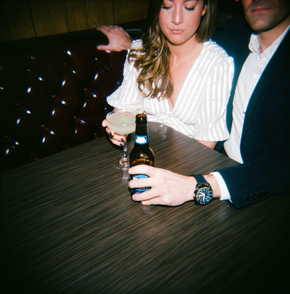 Boston Couple enjoy drinks to celebrate their engagement