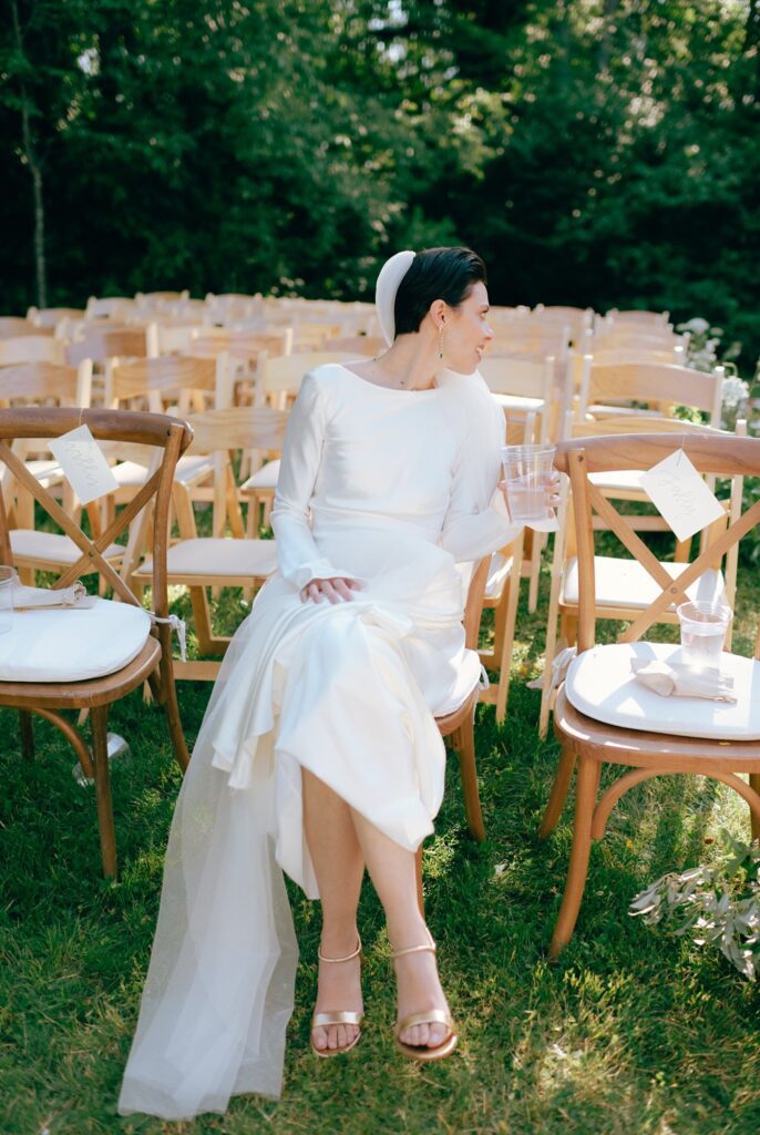 Bride looks back at the seats in the ceremony space