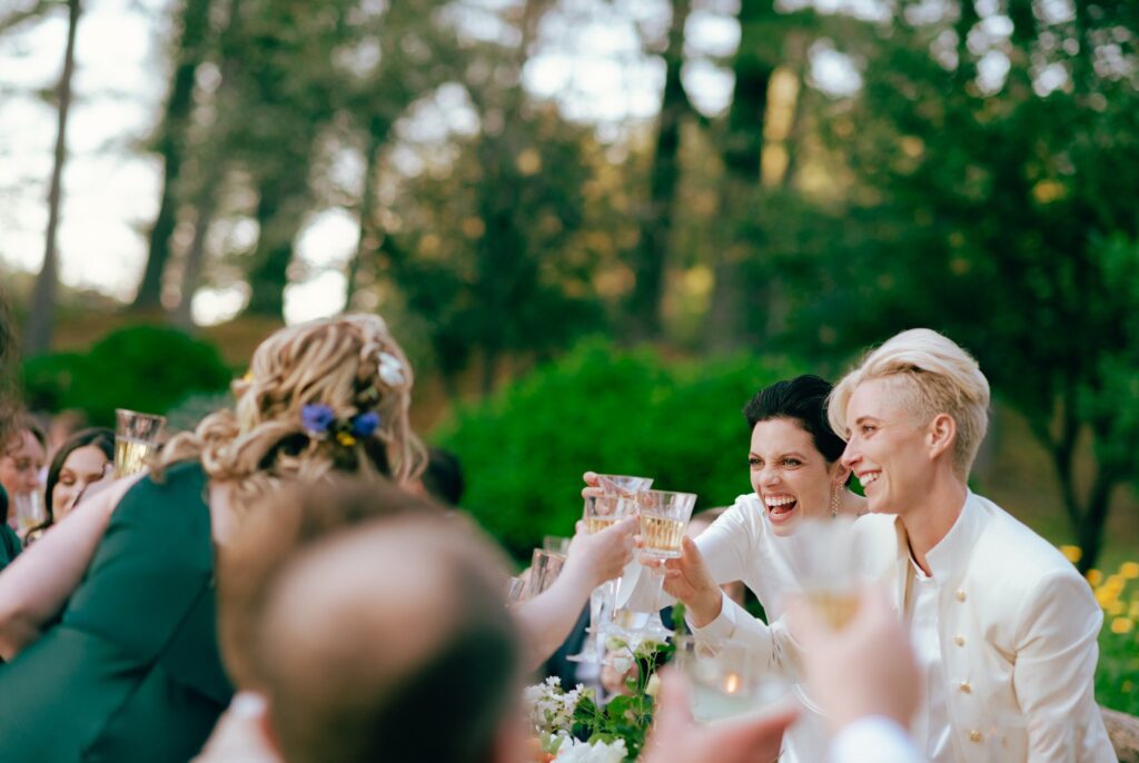 Brides cheers with guests at their Hudson Valley wedding