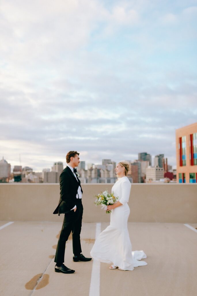 Bride and groom film portrait with Boston skyline in the background