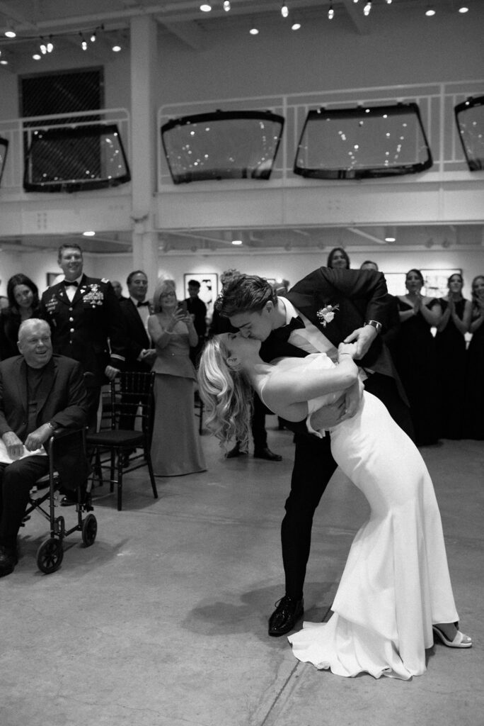 Boston groom dips and kisses his bride, captured on film