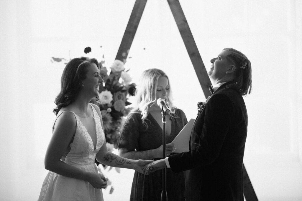 brides laughing during a Boylston Rooms ceremony