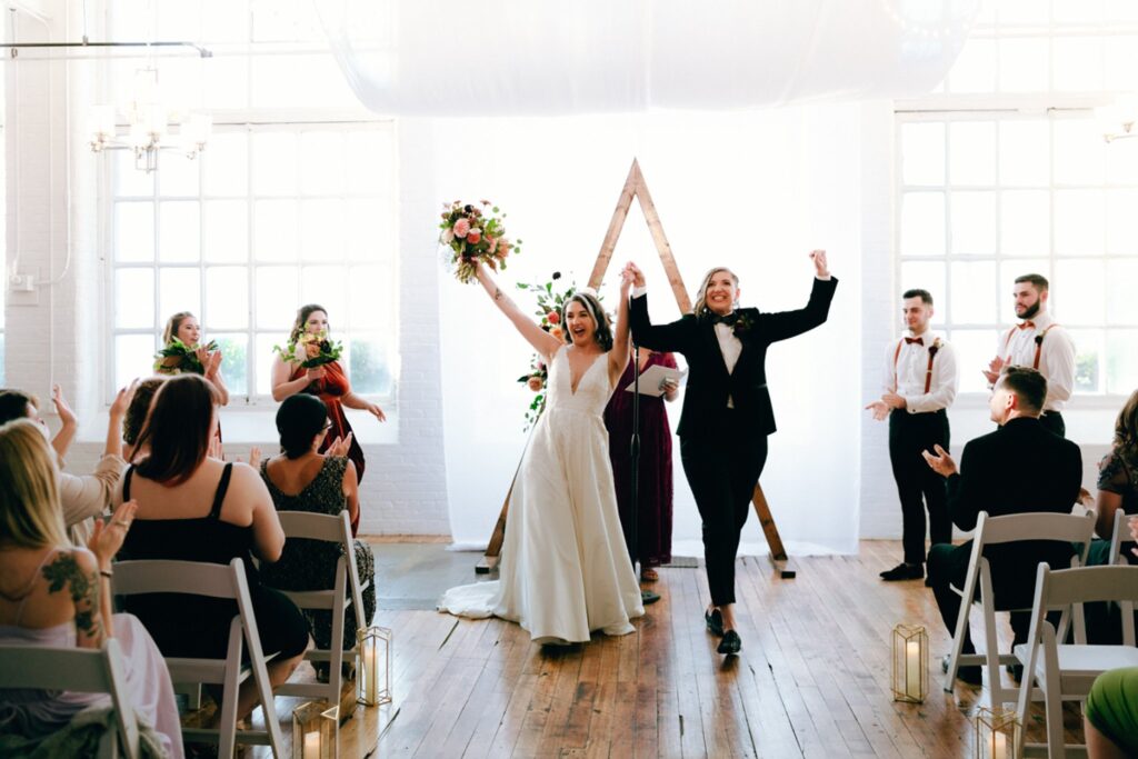brides celebrate after being married at the boylston rooms