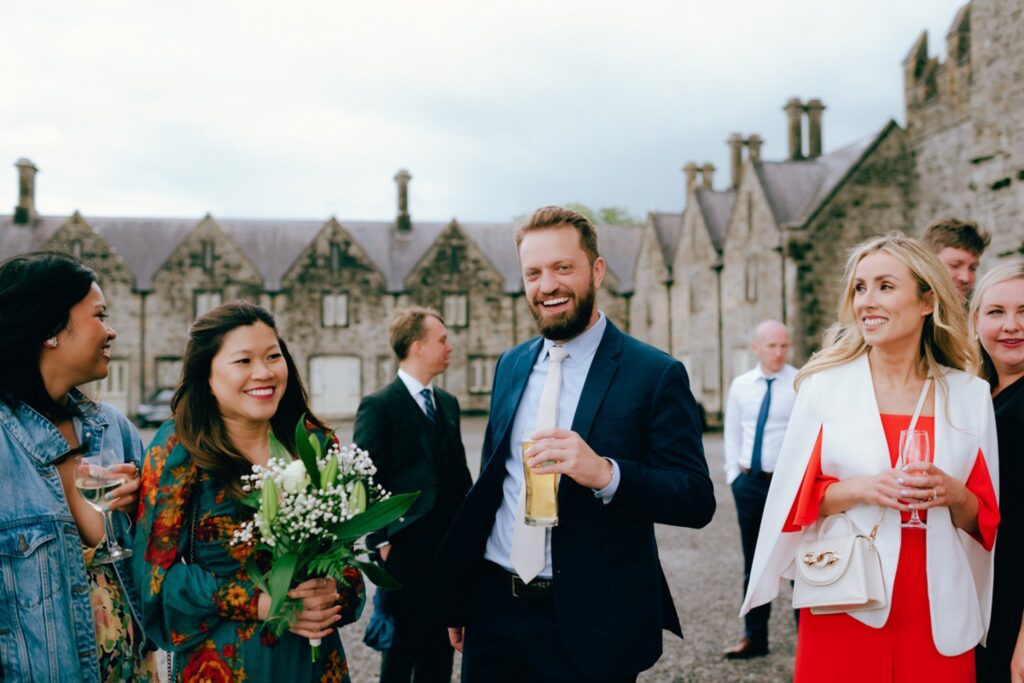 wedding guests enjoy drinks at an Irish wedding