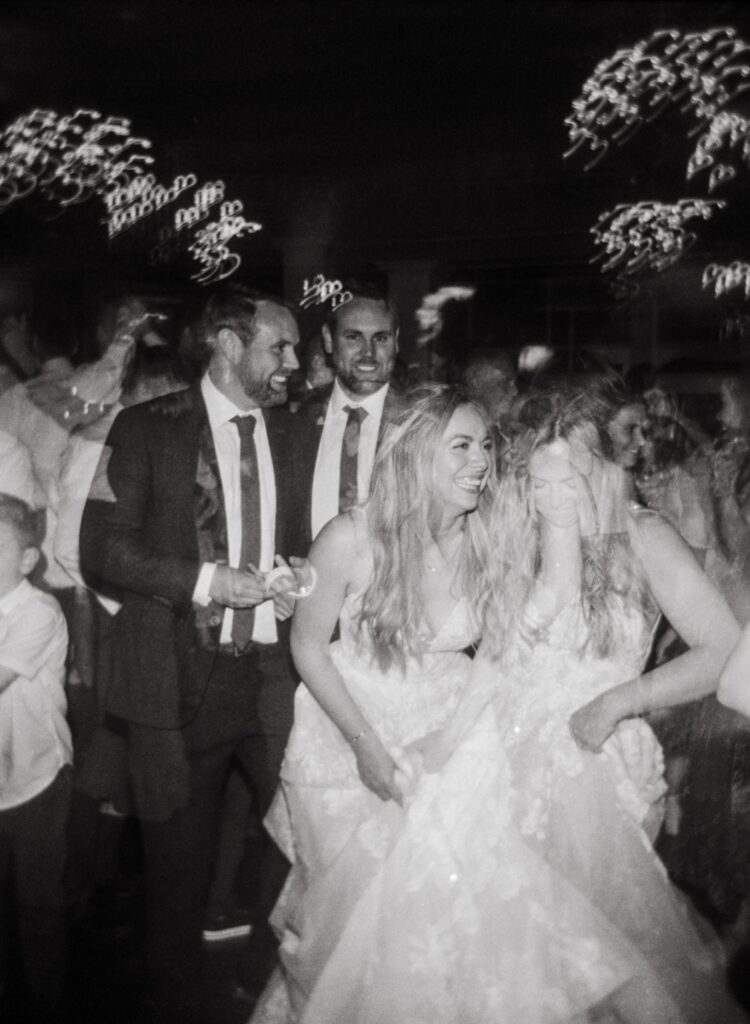 a double exposure of a bride an groom dancing at their wedding
