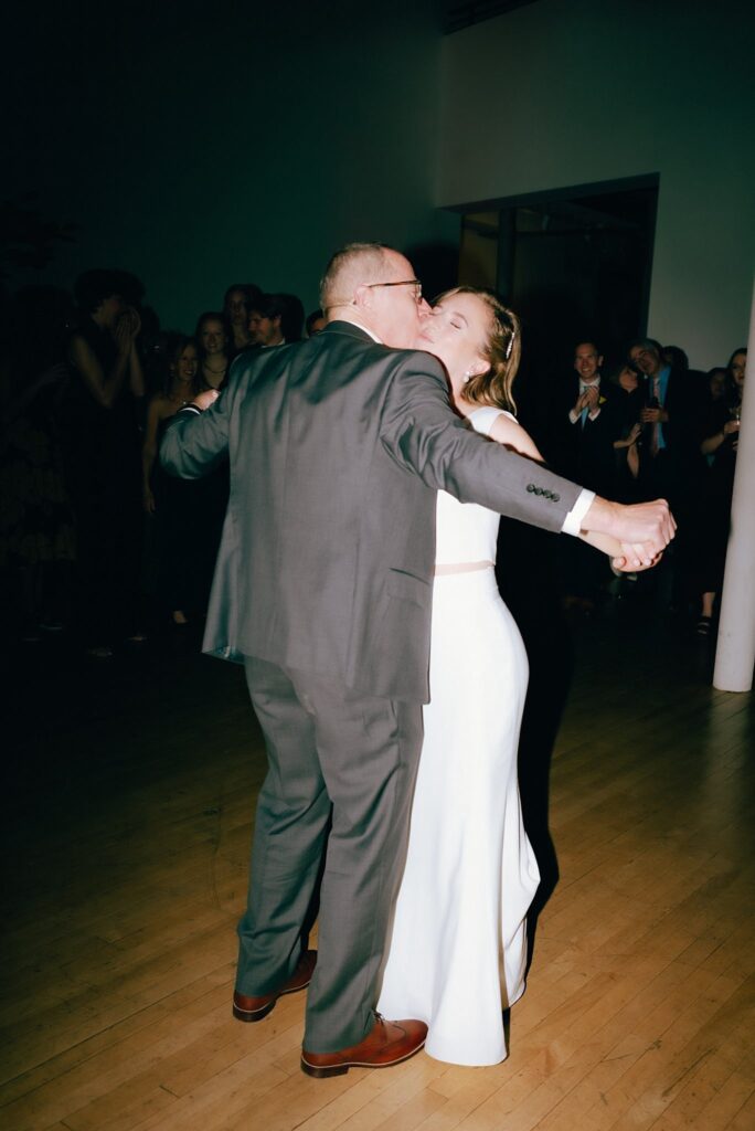 New England bride smiles during dance with her father, captured on film