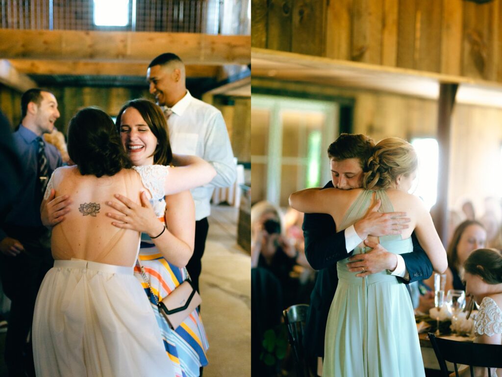 people embrace each other in a wedding barn