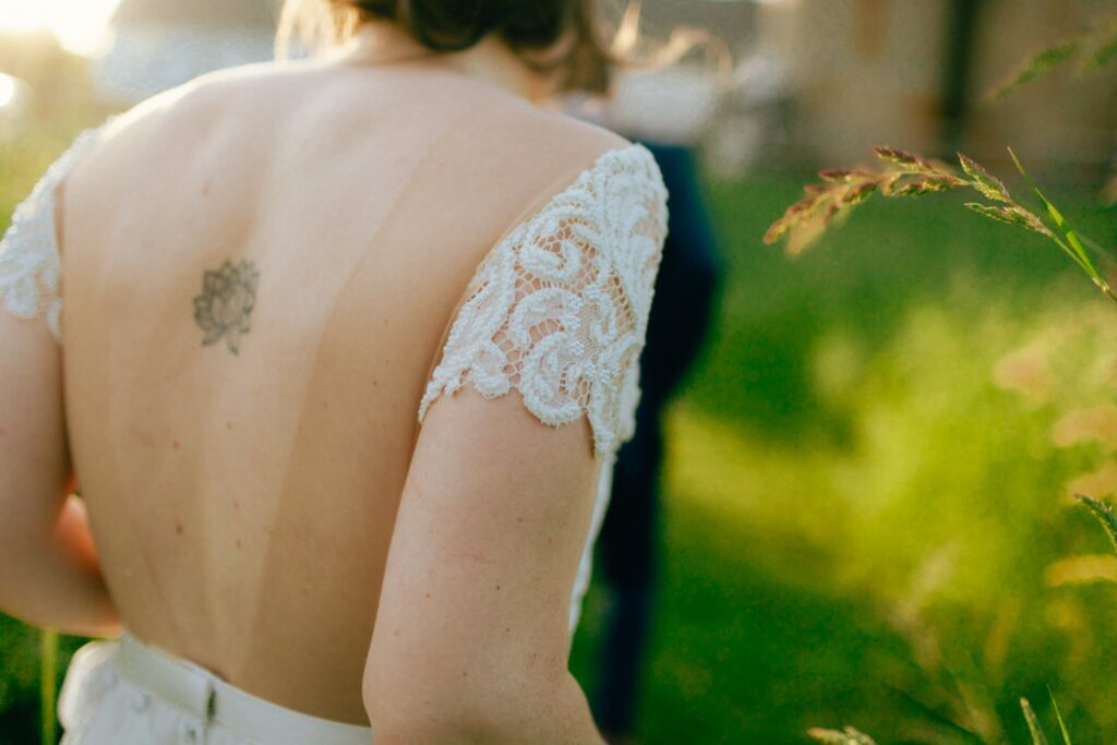 the bride wore a lace adorned truvelle wedding gown