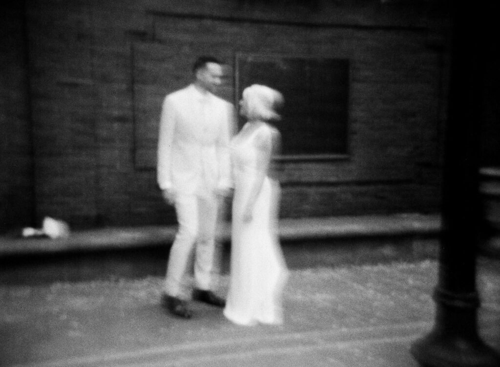 a blurry film portrait of a bride and groom