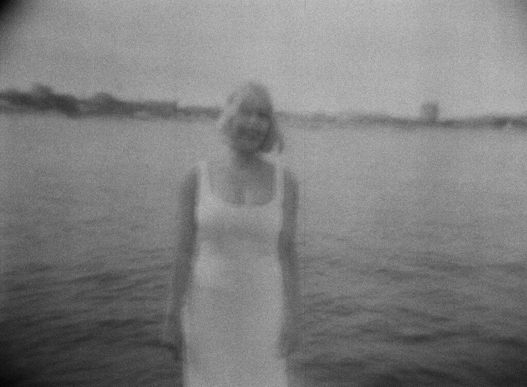 a blurry film photo of a bride