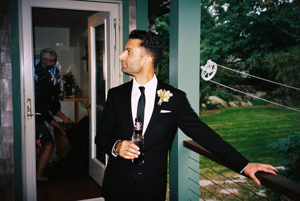 a groom relaxing at his cocktail hour