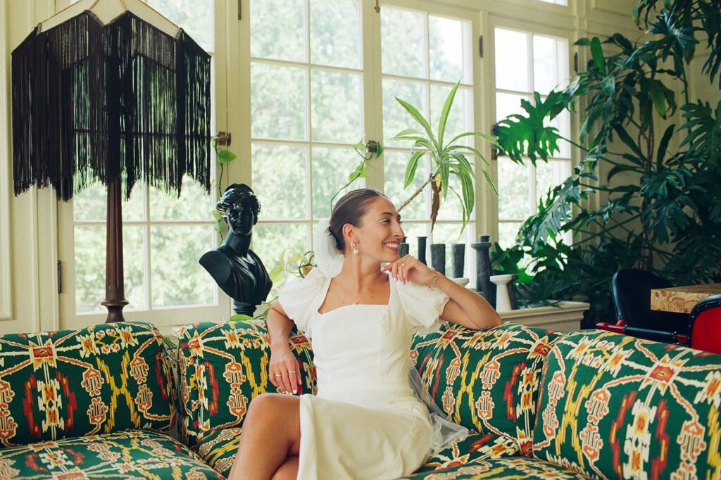 a bride sits in the garden room at Blind Tiger in Burlington, Vermont