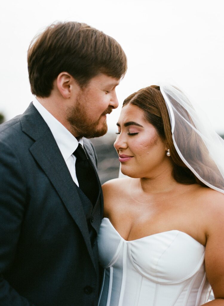 a bride and groom kiss on their wedding day