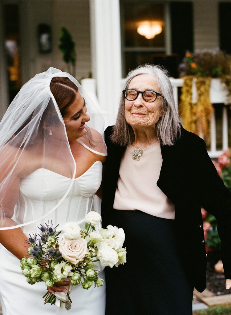 a bride laughs with her grandmother