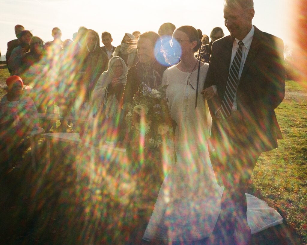 Documentary wedding photograph with solar flare on film
