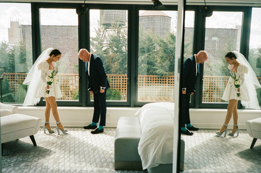 a bride and a groom reflected in a mirror