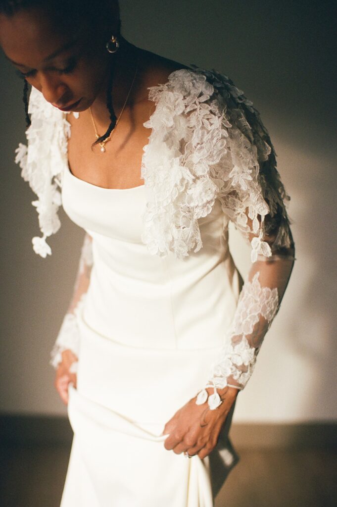 a bride puts on her Danielle Frankel studios gown