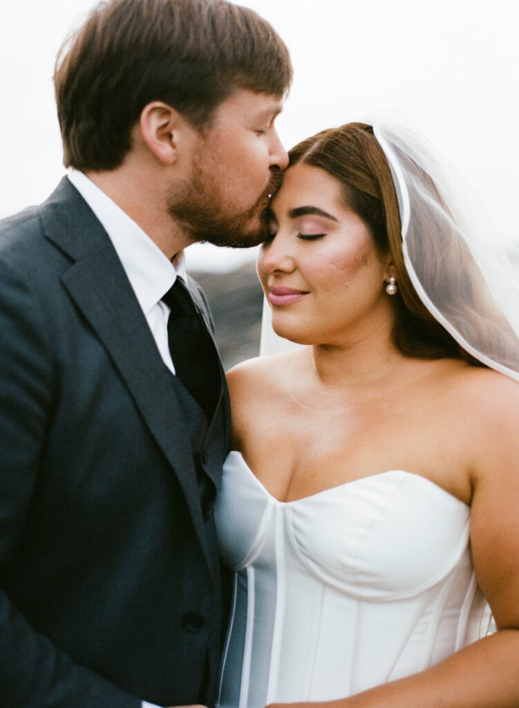 a portrait of a bride and groom on their wedding day