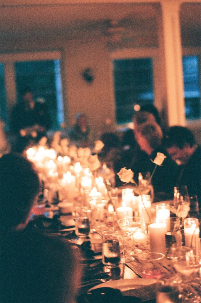 a wedding reception full of candles