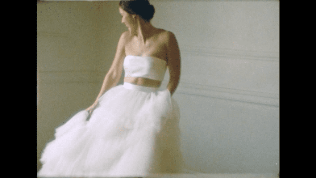 a bride twirls in her dress on the day of her wedding