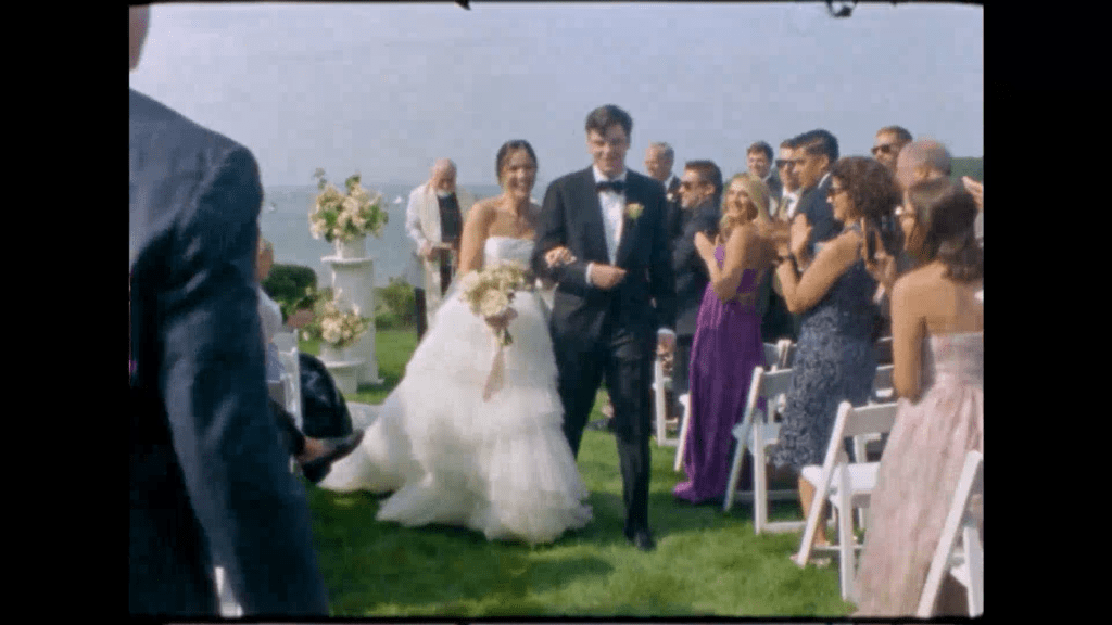 a couple walks back up the aisle after their wedding ceremony