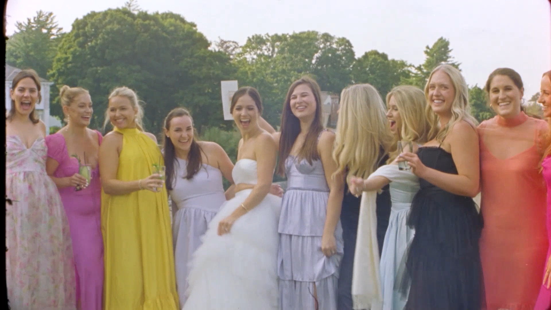 a bride and her friends enjoy cocktail hour